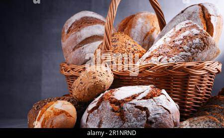 Composition with assorted bakery products in wicker basket Stock Photo