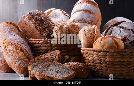 Composition with assorted bakery products in wicker basket Stock Photo