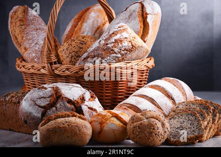 Composition with assorted bakery products in wicker basket Stock Photo