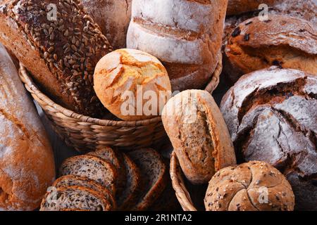 Composition with assorted bakery products in wicker basket Stock Photo