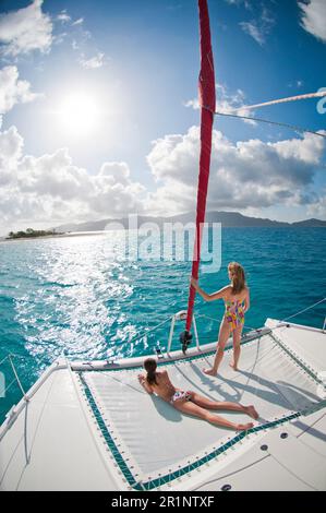 Mother and daughter sailing in the tropics. Stock Photo