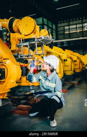Robotic engineer conduct regular maintenance by inspecting, testing ...