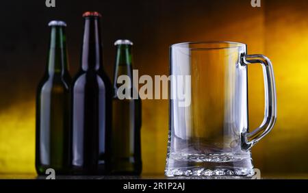 Composition with empty glass and bottles of beer Stock Photo