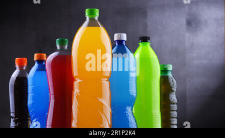 Plastic bottles of assorted carbonated soft drinks in variety of colors Stock Photo