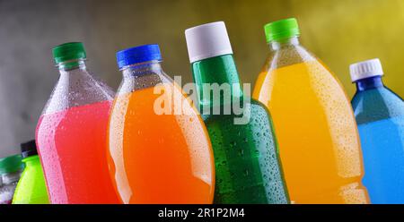 Plastic bottles of assorted carbonated soft drinks in variety of colors Stock Photo