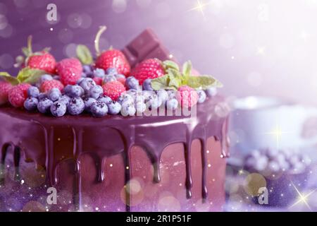 Freshly made tasty chocolate cake decorated with berries on table, closeup. Tasty dessert for Christmas dinner Stock Photo