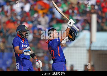 Indian batter Ishan Kishan celebrates his hundred runs along Virat ...