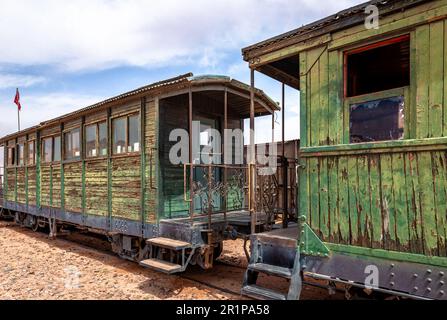 Obsolete train wagons from a bygone era in Wadi Rum, the famous Jordanian desert. Stock Photo