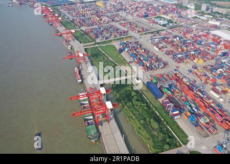 NANJING, CHINA - MAY 15, 2023 - Cargo ships dock at the Longtan Container Terminal of Nanjing Port in Nanjing, Jiangsu province, China, May 15, 2023. Stock Photo