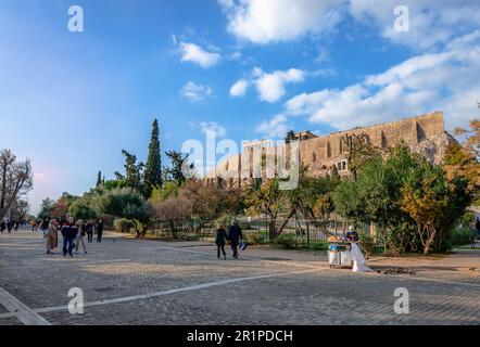 View of Dionysiou Areopagitou pedestrian street on a sunny afternoon, with the Acropolis on the background. in Athens, Greece. Stock Photo