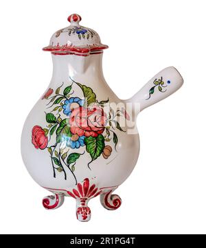 French white porcelain pitcher or coffee pot, decorated with flowers, roses and anemones Stock Photo