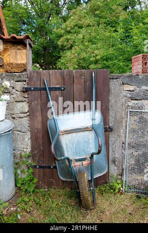 Wheelbarrow, wooden gate, monastery garden, Propstei Zella, garden, Zella, Rhön, Wartburgkreis, Thuringia, Germany, Europe, Stock Photo