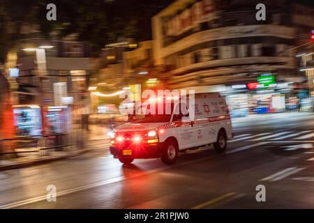 Ambulance moving quickly through the streets of Tel Aviv Israel December 2022 Stock Photo