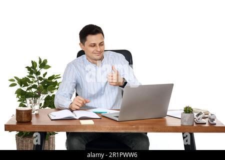 businessman talking at laptop webcam, using laptop Stock Photo