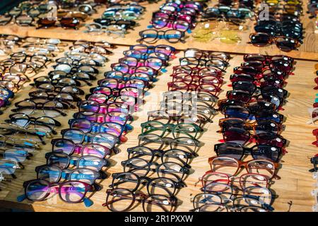 A variety of glasses on a market stall, Tel Aviv Israel December 2022 Stock Photo
