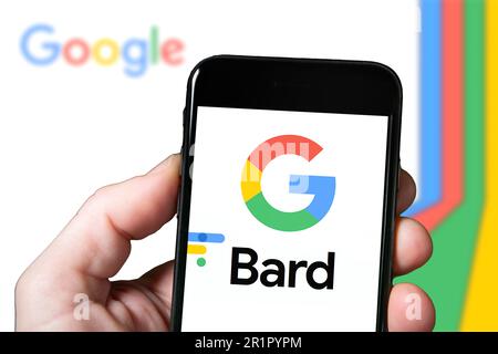 Goggle Bard AI chatbot tool, artificial intelligence. Man with smartphone using Bard Ai website. mobile screen with Bard AI Stock Photo