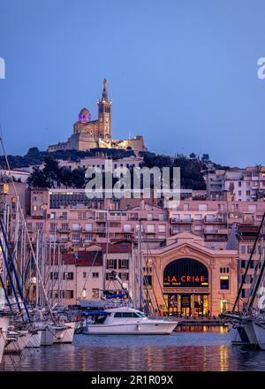 Theater 'La Criée' and Notre-Dame de la Garde at dusk, Marseille, Provence-Alpes-Cote d'Azur, France, Stock Photo