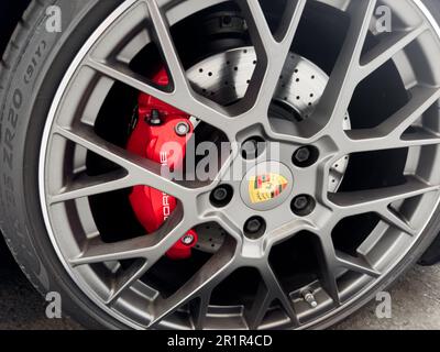Yerevan, Armenia, May 2, 2023 : Front view of logo of Porsche 911 GT3 RS on alloy wheel. Car exterior details. Tyre and alloy wheel. Modern brakes. Stock Photo