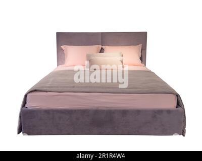 Elegant cozy bed with headboard, blanket and pillows isolated on white background. Bed with a blanket and pillows isolated Stock Photo