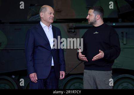 Aachen, Germany. 14th May, 2023. German Chancellor Olaf Schotz, left, listens to Ukrainian President Volodymyr Zelenskyy, right, during visit to Camp Aachen, May 14, 2023 in Aachen, Germany. The Germany Army is training Ukrainian soldiers on military hardware provided by Germany at the base. Credit: Pool Photo/Ukrainian Presidential Press Office/Alamy Live News Stock Photo