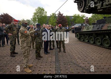 Aachen, Germany. 14th May, 2023. German Chancellor Olaf Schotz, left, and Ukrainian President Volodymyr Zelenskyy, center, watch a demonstration during a visit to Camp Aachen, May 14, 2023 in Aachen, Germany. The Germany Army is training Ukrainian soldiers on military hardware provided by Germany at the base. Credit: Pool Photo/Ukrainian Presidential Press Office/Alamy Live News Stock Photo