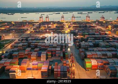 NANJING, CHINA - MAY 15, 2023 - Containers are seen at the Longtan Container Terminal of Nanjing Port at night in Nanjing, Jiangsu province, China, Ma Stock Photo