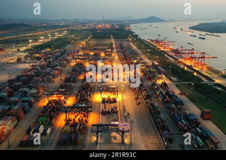 NANJING, CHINA - MAY 15, 2023 - The Longtan Container Terminal of Nanjing Port works at night in Nanjing, Jiangsu province, China, May 15, 2023. May 1 Stock Photo