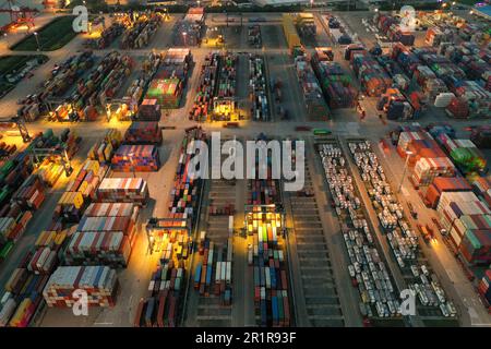 NANJING, CHINA - MAY 15, 2023 - Containers are seen at the Longtan Container Terminal of Nanjing Port at night in Nanjing, Jiangsu province, China, Ma Stock Photo