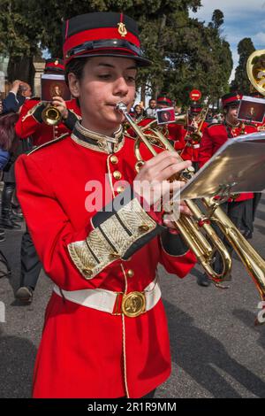 Woman musician in jacket with decorative cuffs, trumpeter, The Old Philharmonic marching band, Agoniston Polytehniou street at Spianada Square, Agios Georgios (Saint George) procession, Good Friday, Holy Week, town of Corfu, Corfu Island, Greece Stock Photo