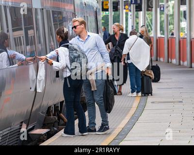 Passengers boarding the Airport Express, Flytoget, at Lysaker Station near Oslo in Norway., on its way to Oslo International Airport, Gardermoen. Stock Photo