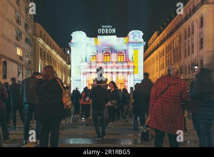 Bucharest, Romania - April 2023: The Bust of Mustafa Kemal Atatrk in front of the Odeon Theatre. Cultural bulding at night in the center of Bucharest. Stock Photo