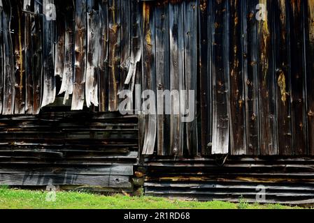 Weathered old barn with warped boards Stock Photo