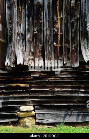 Weathered old barn with warped boards Stock Photo