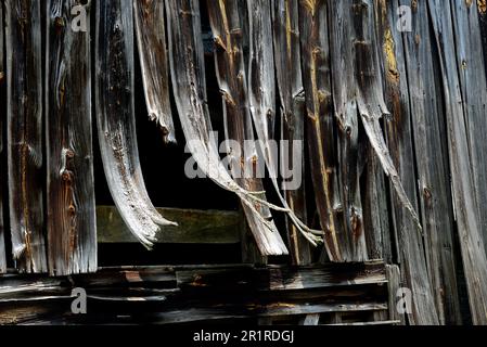 Weathered old barn with warped boards Stock Photo
