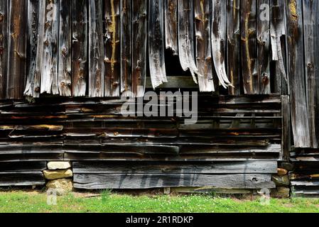 Weathered old barn with warped boards Stock Photo