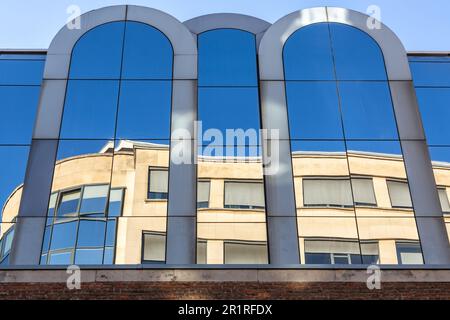 Reflection on windows with blue panes. Brussels Stock Photo