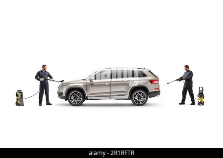 Workers in uniforms washing a SUV with a pressure washer machines isolated on white background Stock Photo