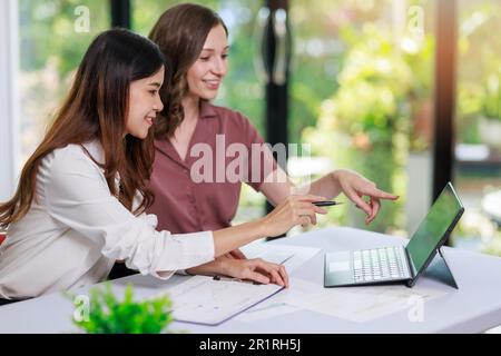 Concept of business investment or working woman, Closeup businesswoman discussing or working on analysis of business investment documents and using co Stock Photo