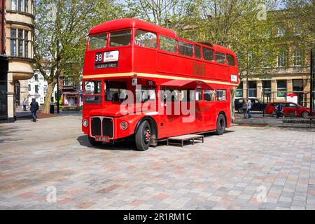 Bright red 1966 Routemaster London double decker bus converted for use as a mobile bar Stock Photo