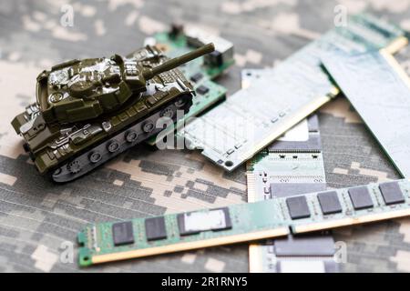 The toy tank is on the table. Children's toy military tank Stock Photo