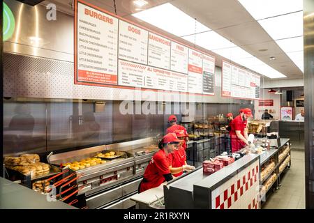 London- May 2023: Interior of a Five Guys burger chain restaurant in London's West End Stock Photo