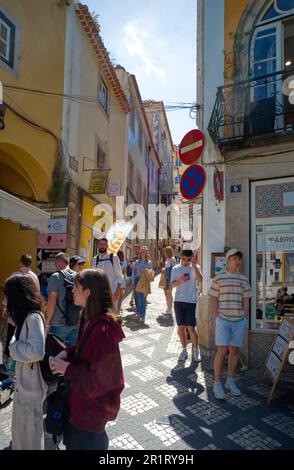 The narrow streets of Sintra are thronged with tourists during the day Stock Photo