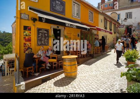 The narrow streets of Sintra abound with cafes and bars with shade from the hot sun Stock Photo