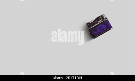 Isolated metallic lighter on grey background , added copy space for text. Stock Photo