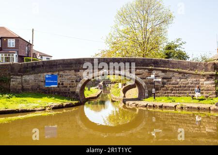 Canal bridge over the Macclesfield canal at its junction with the Peak forest canal at Marple in Greater Manchester Stock Photo