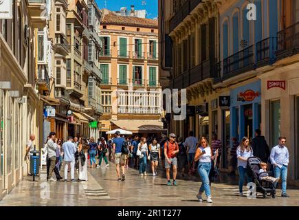 Shopping street with traditional Spanish architecture in the centre of Malaga a major city in Malaga Province, Andalucia, southern Spain. Stock Photo