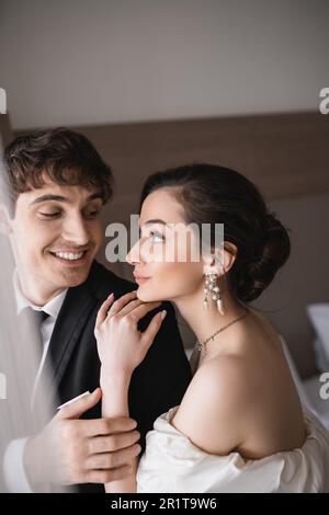 Wedding couple in hotel room Stock Photo - Alamy