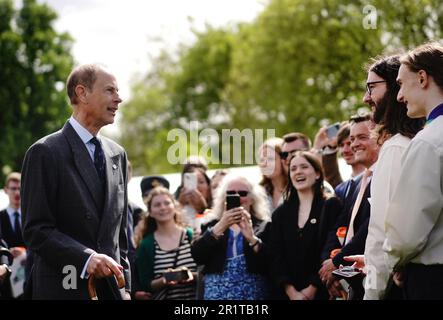 The Duke of Edinburgh talks to guests as he hosts young people from The Duke of Edinburgh's Award scheme in the garden of Buckingham Palace, London. Picture date: Monday May 15, 2023. Stock Photo