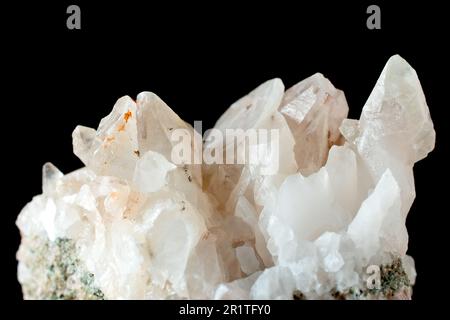 Close up of a rock containing milky quartz crystals, one of the commonest rock-forming silicate minerals. Stock Photo