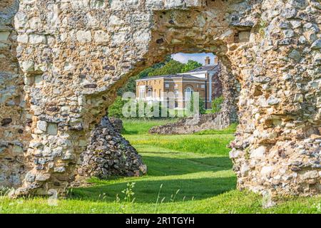 Waverley Abbey House near Farnham in Surrey, seen through the ruins of Waverley Abbey, the first Cistercian Abbey in England. Stock Photo